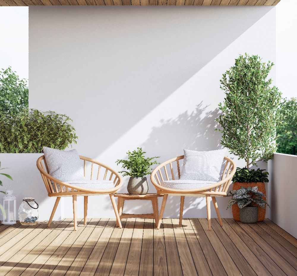 A comfortable outdoor patio setup with deep seating and lounge chairs